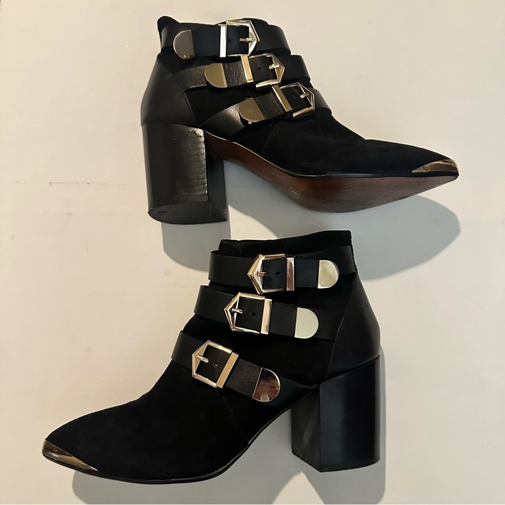 Report Signature Black Ankle Boots with Gold Buckle Accents